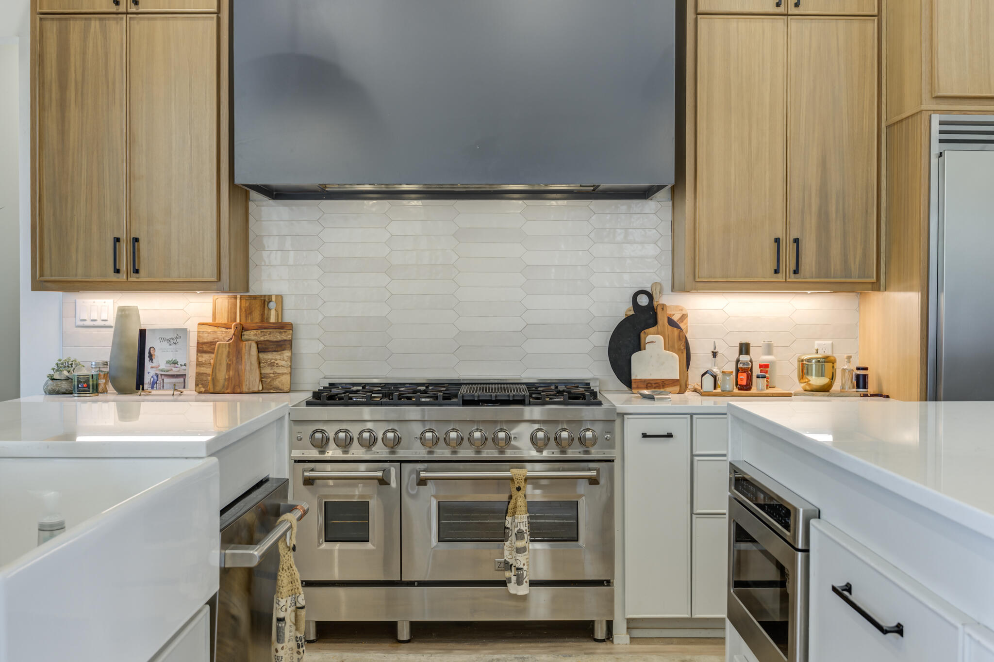 3940 148th Street Lubbock, TX 79423 - Photo 24 of 92 a kitchen with a stove and a sink