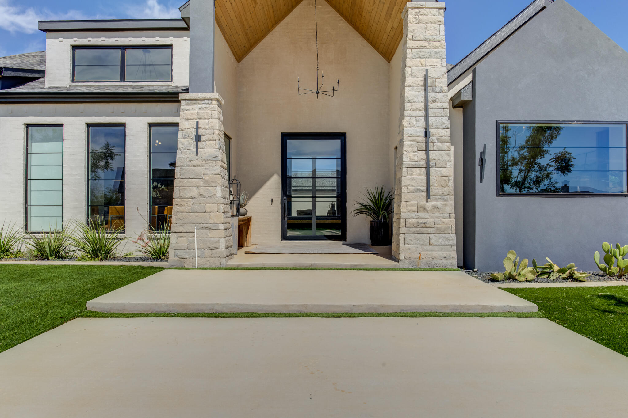3940 148th Street Lubbock, TX 79423 - Photo 3 of 92 a front view of a house with a garden and plants