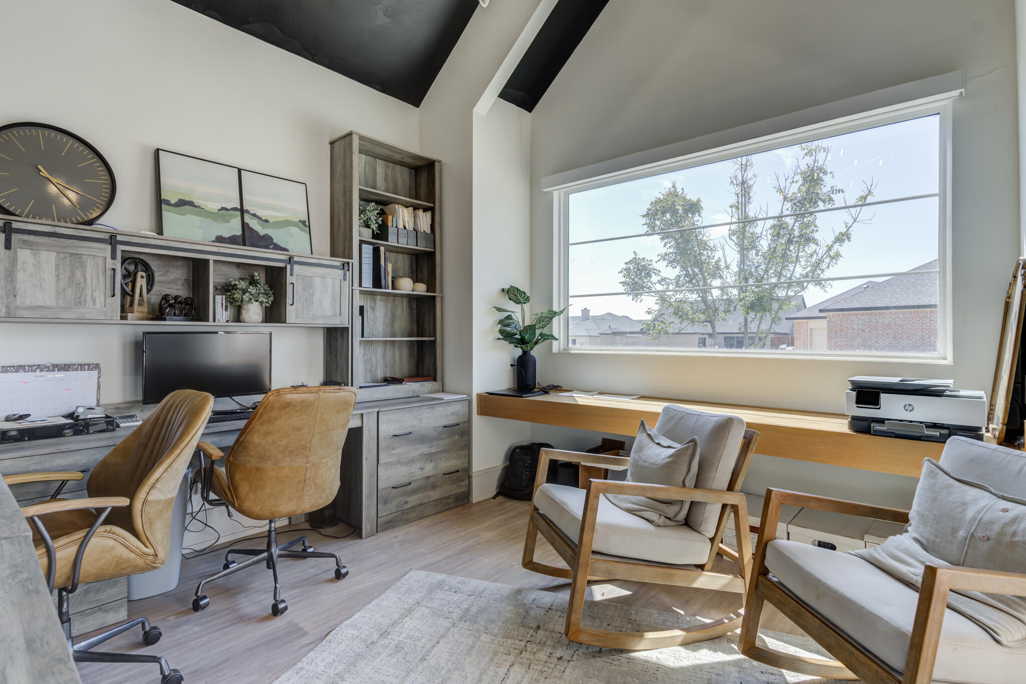 3940 148th Street Lubbock, TX 79423 - Photo 39 of 92 a view of a workspace with furniture and a window