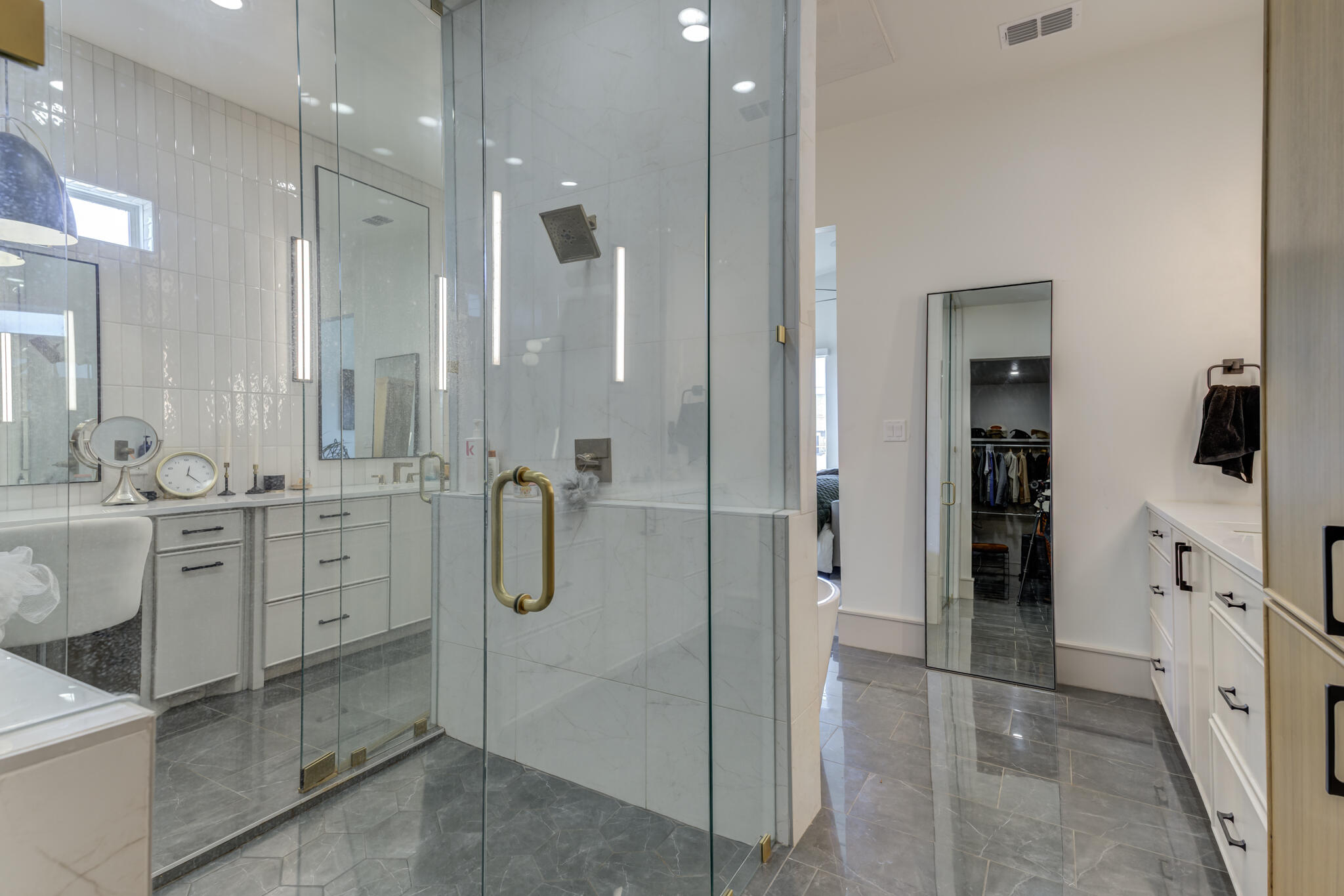 3940 148th Street Lubbock, TX 79423 - Photo 52 of 92 a bathroom with a double vanity sink mirror and shower