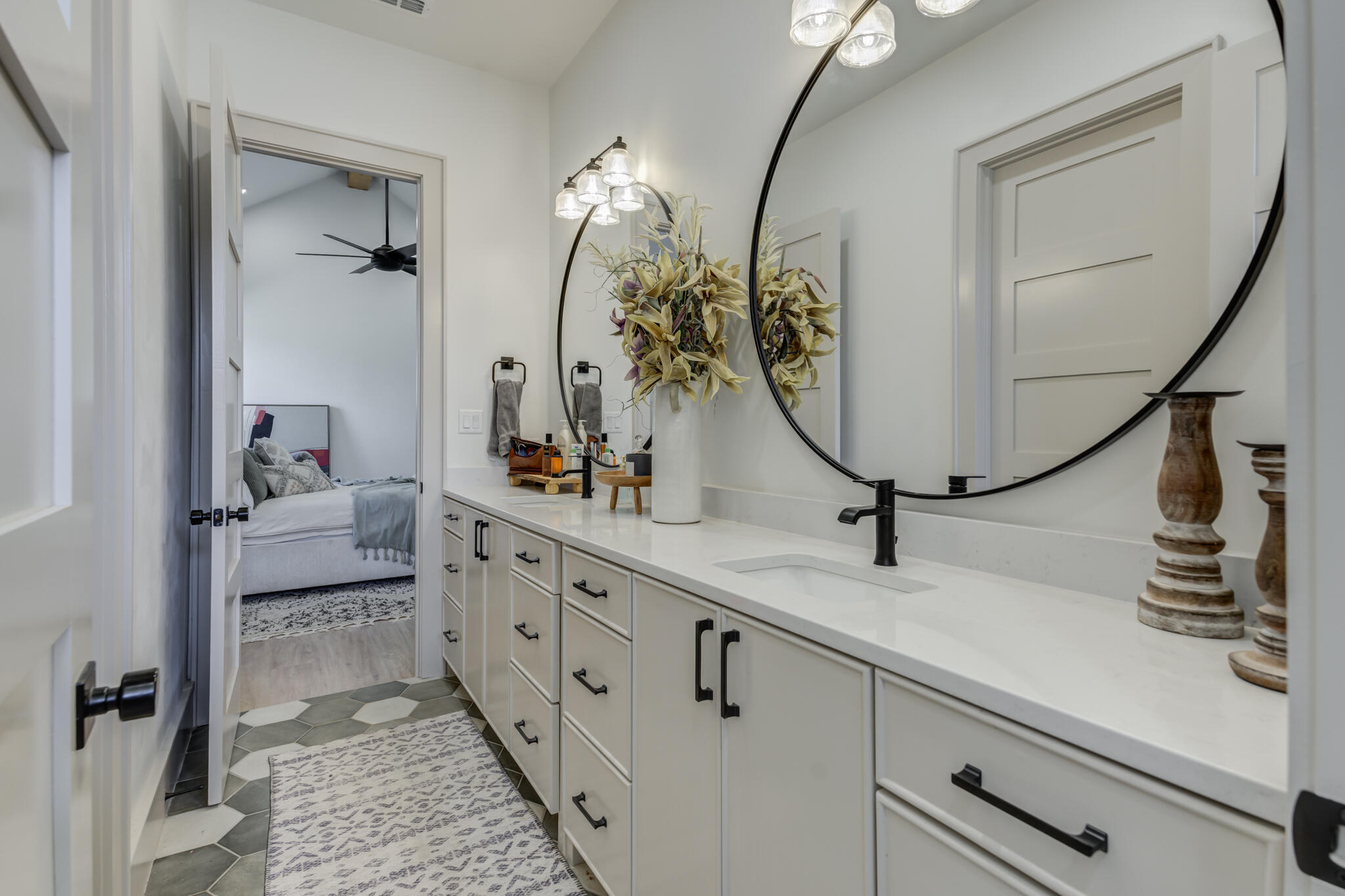 3940 148th Street Lubbock, TX 79423 - Photo 56 of 92 a bathroom with a double vanity sink and a mirror