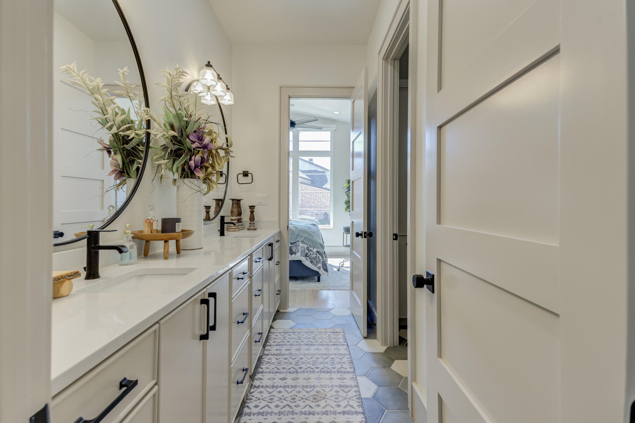 3940 148th Street Lubbock, TX 79423 - Photo 60 of 92 a bathroom with a sink and mirror