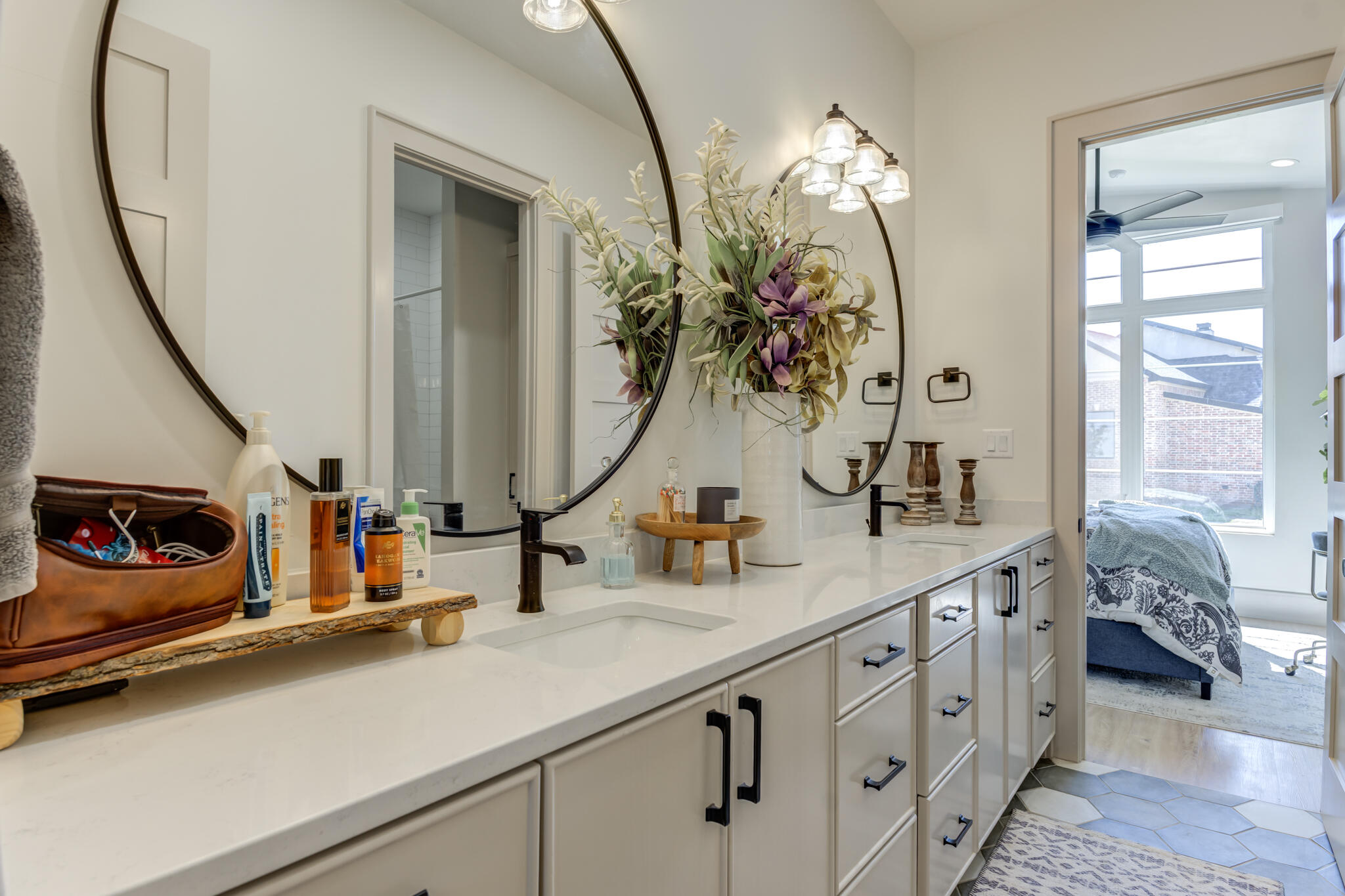 3940 148th Street Lubbock, TX 79423 - Photo 61 of 92 a bathroom with double vanity sink and a mirror