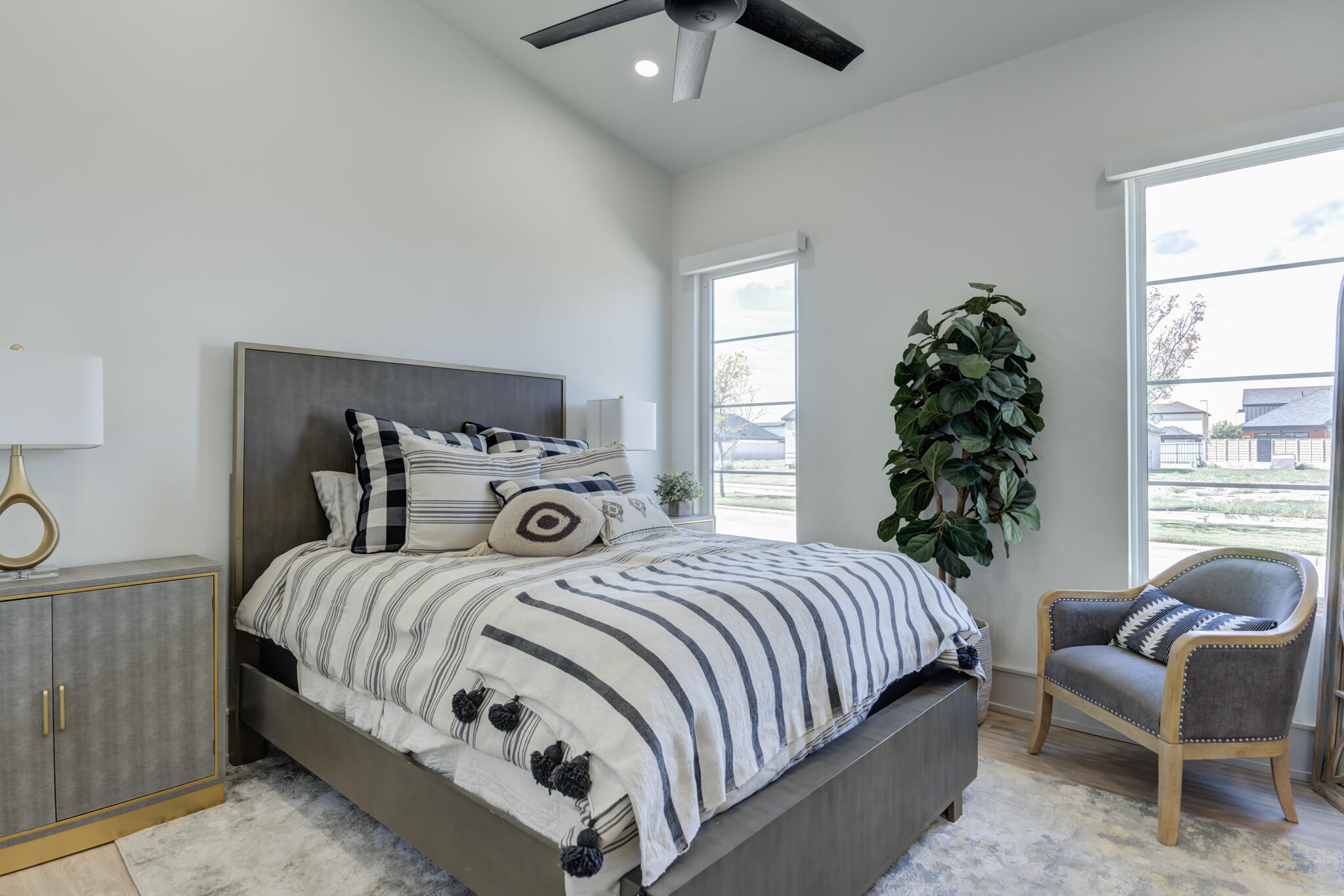 3940 148th Street Lubbock, TX 79423 - Photo 63 of 92 a bedroom with a bed and a chair