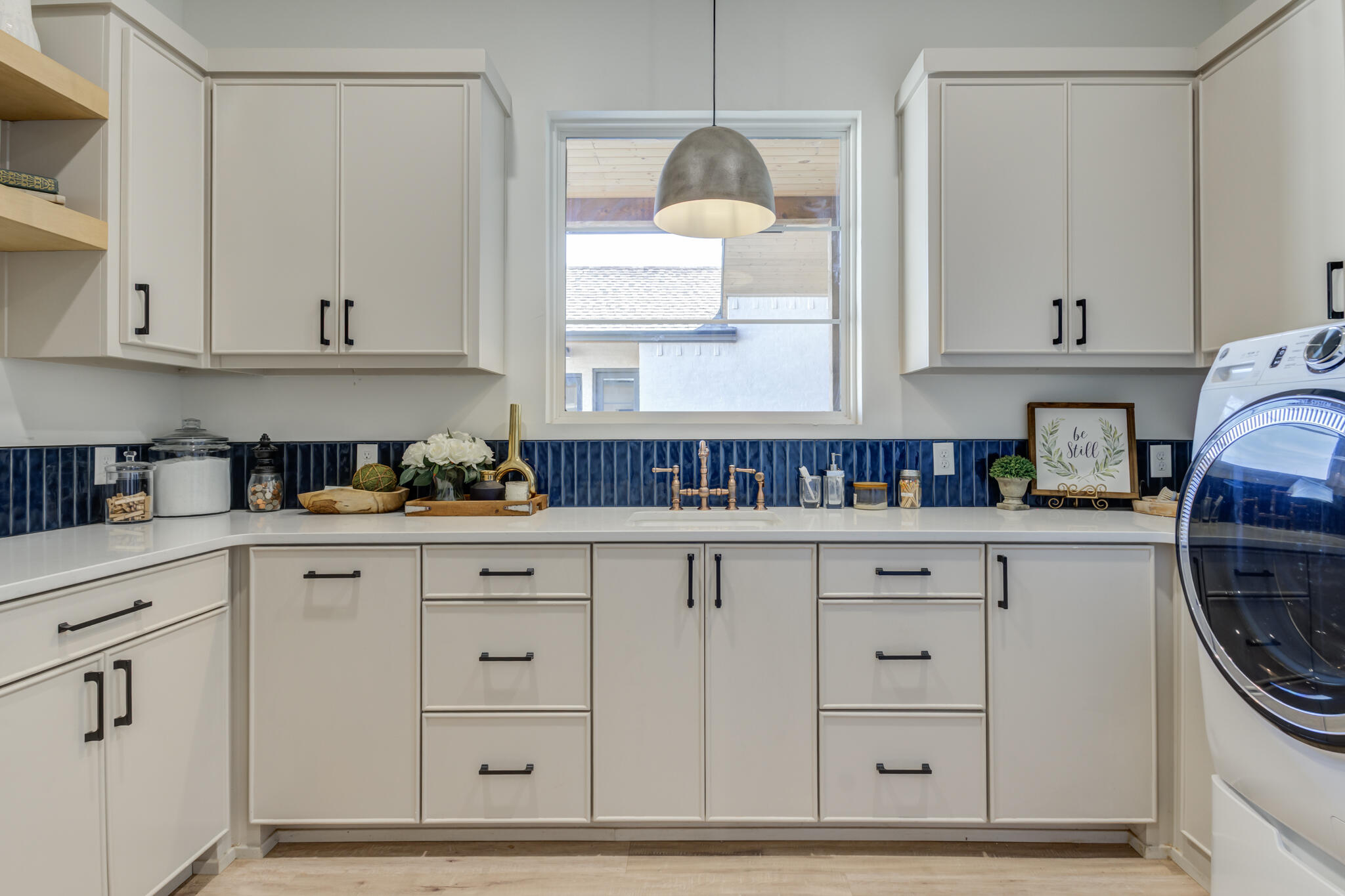 3940 148th Street Lubbock, TX 79423 - Photo 69 of 92 a kitchen with granite countertop white cabinets and a sink