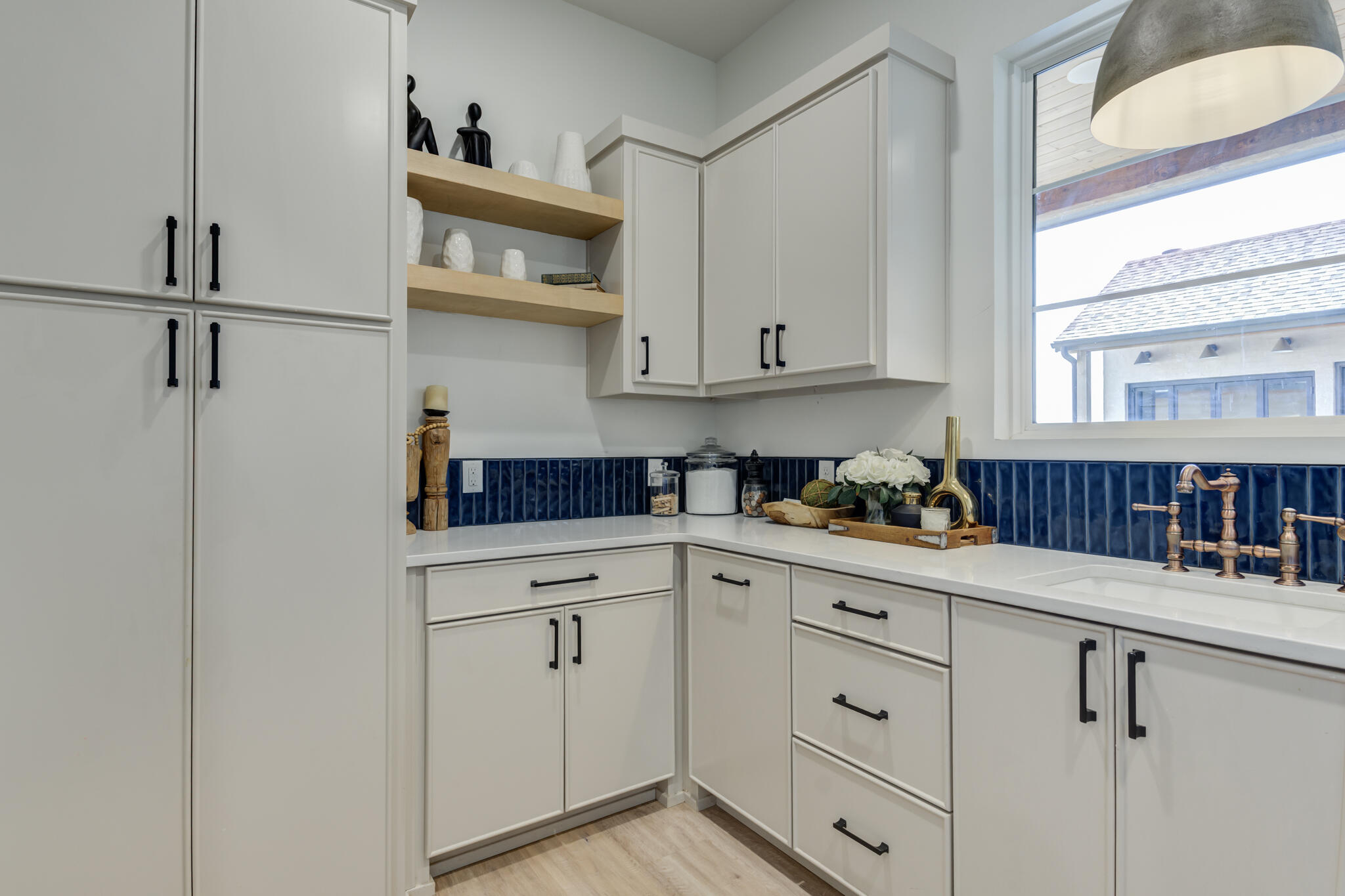 3940 148th Street Lubbock, TX 79423 - Photo 70 of 92 a kitchen with white cabinets and white appliances