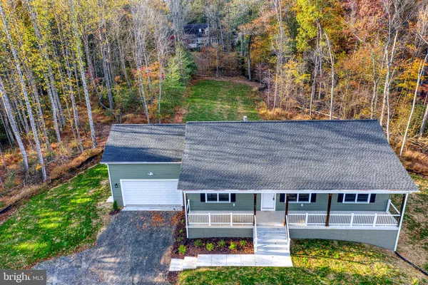 a view of outdoor space with playground and green space