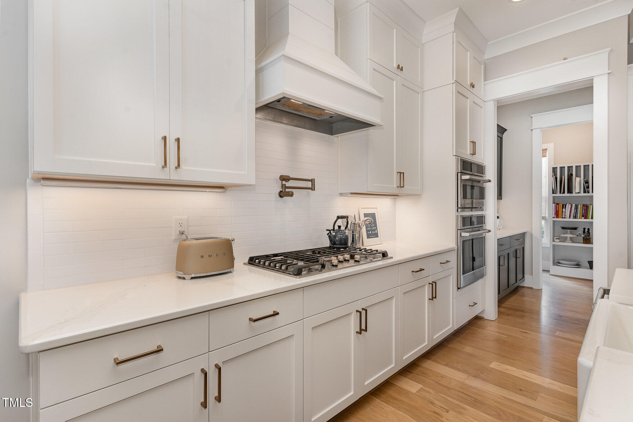403 Stonecrest Way Pittsboro, NC 27312 - Photo 15 of 65 a kitchen with stainless steel appliances granite countertop a sink and cabinets