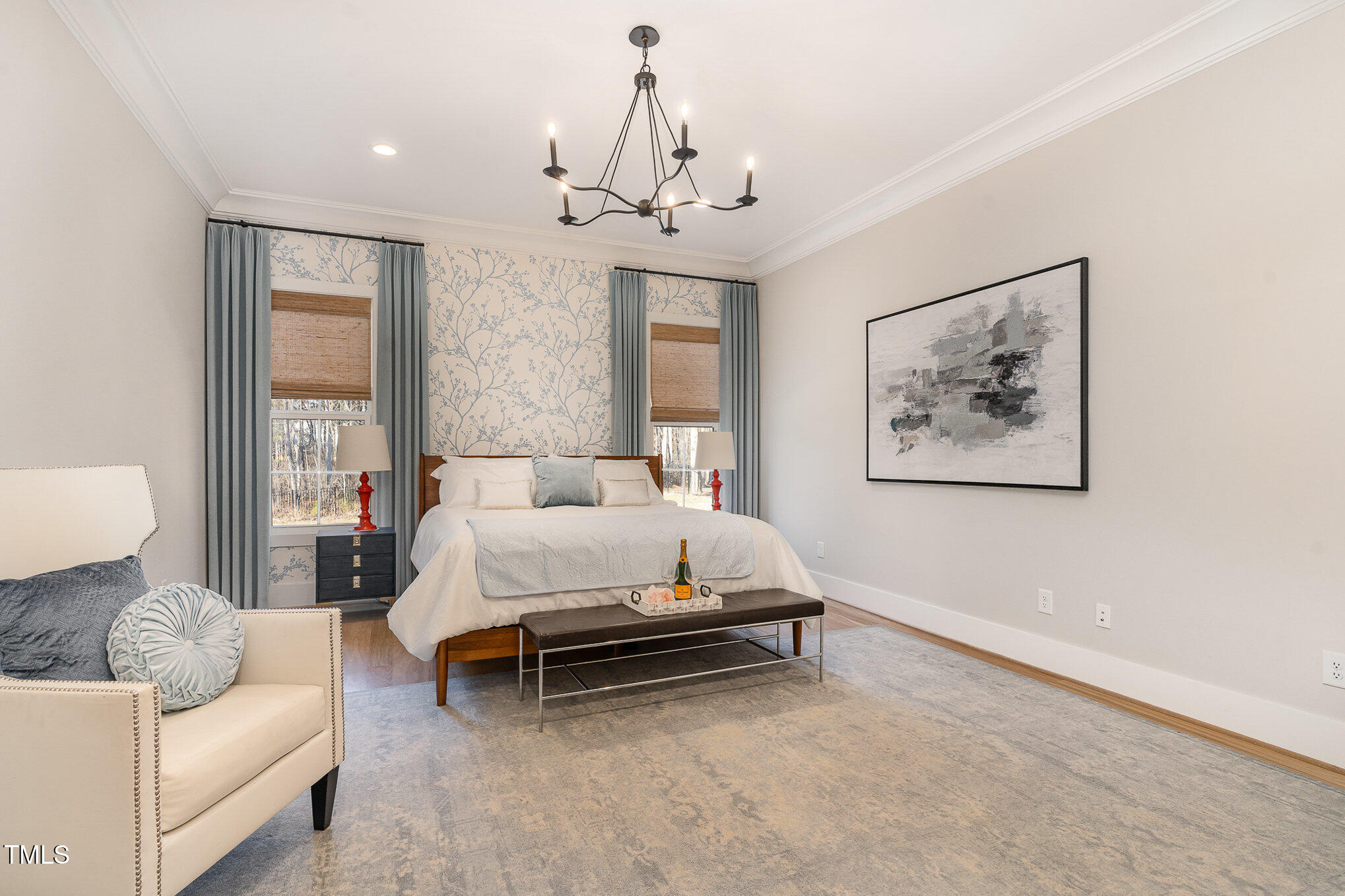 403 Stonecrest Way Pittsboro, NC 27312 - Photo 21 of 65 a spacious bedroom with a bed couch chandelier and a window