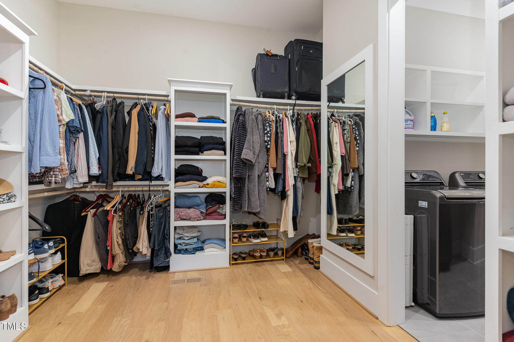 403 Stonecrest Way Pittsboro, NC 27312 - Photo 25 of 65 a view of walk in closet with clothes and shoes