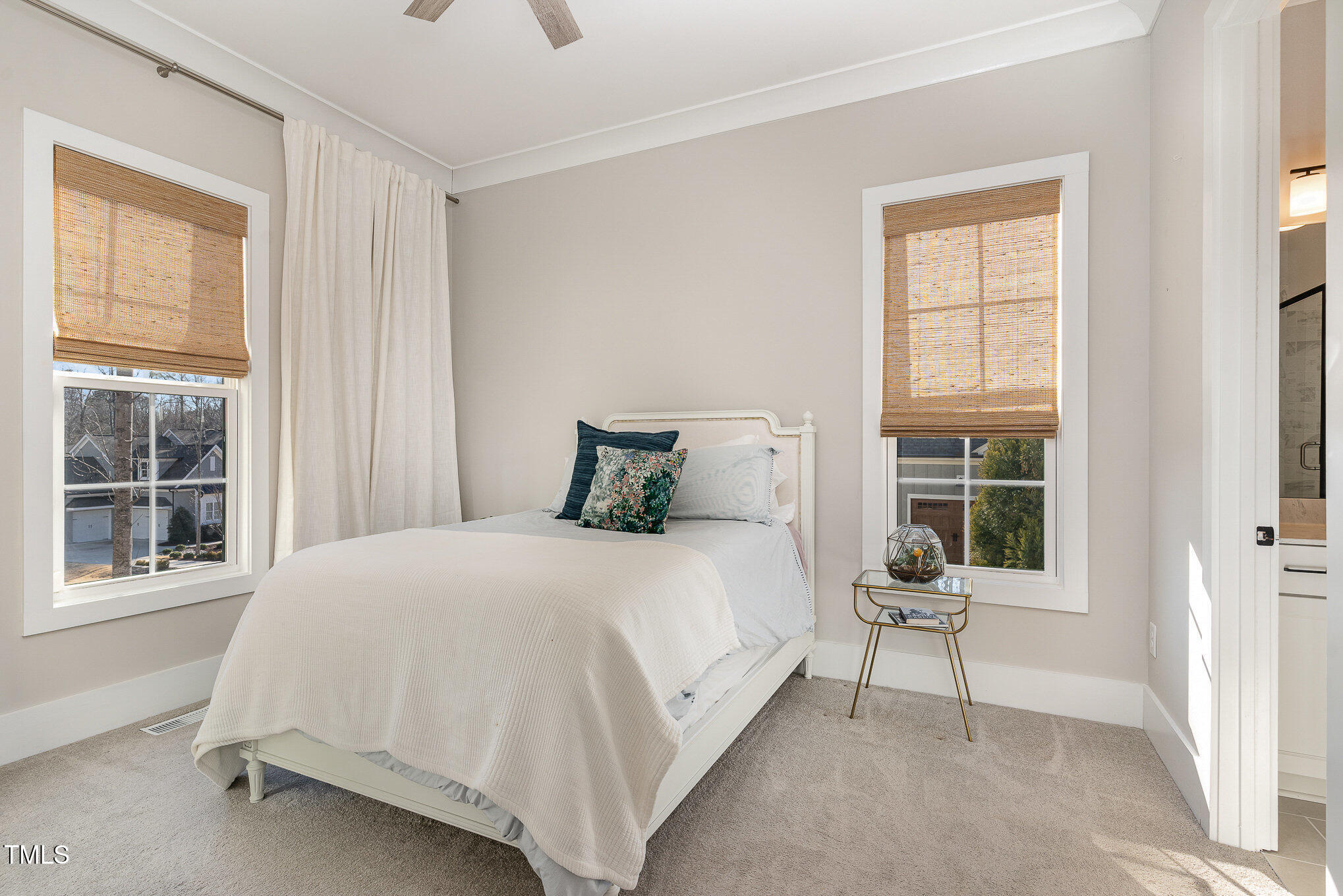 403 Stonecrest Way Pittsboro, NC 27312 - Photo 29 of 65 a large bed sitting in a bedroom next to a window