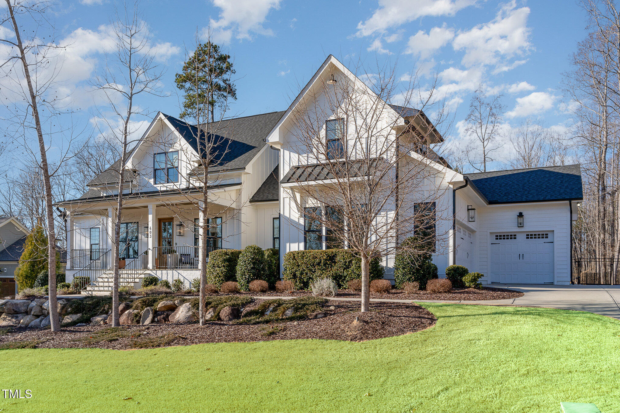 403 Stonecrest Way Pittsboro, NC 27312 - Photo 3 of 65 a front view of a house with garden