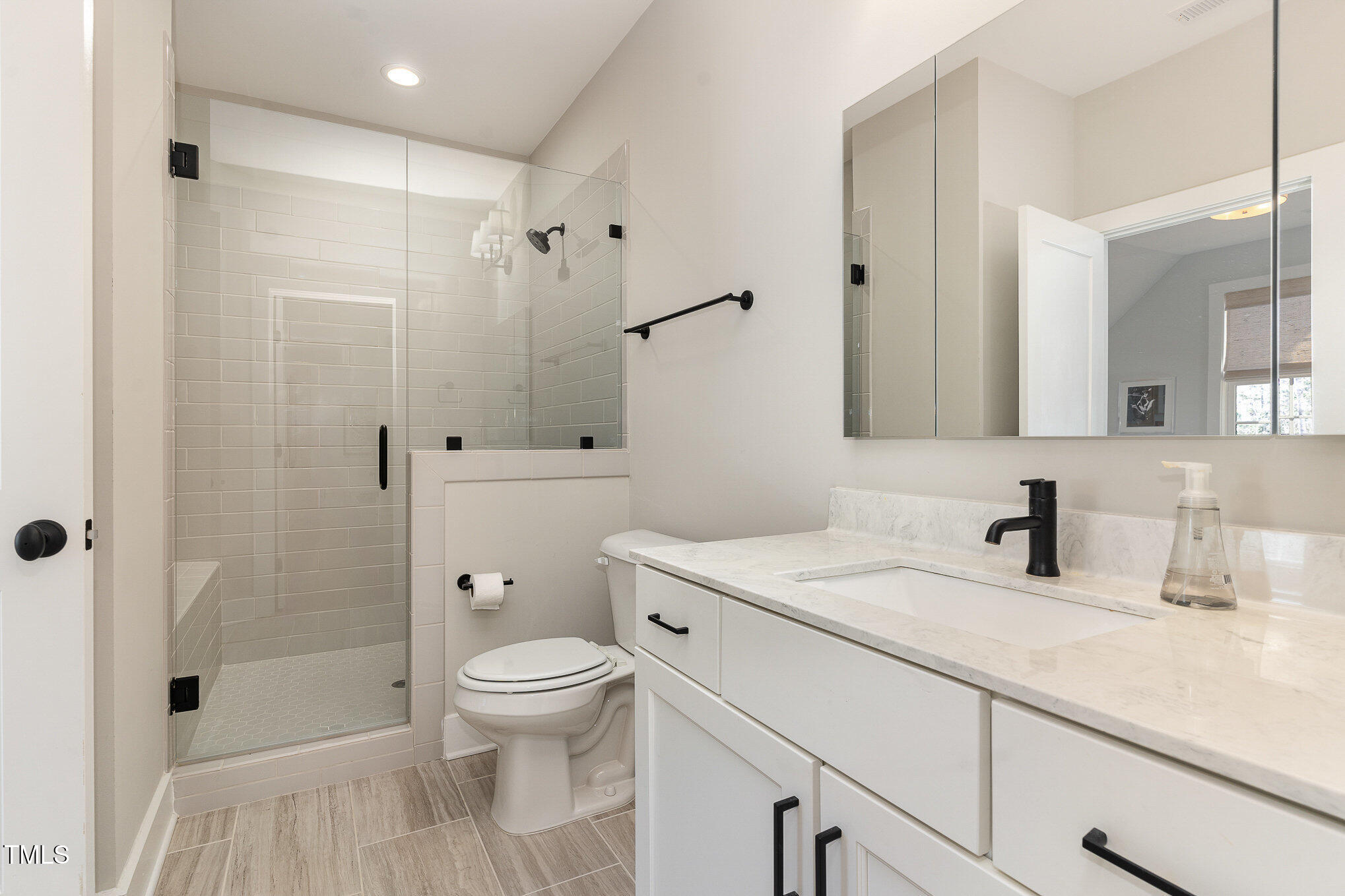 403 Stonecrest Way Pittsboro, NC 27312 - Photo 34 of 65 a bathroom with a sink a toilet and shower