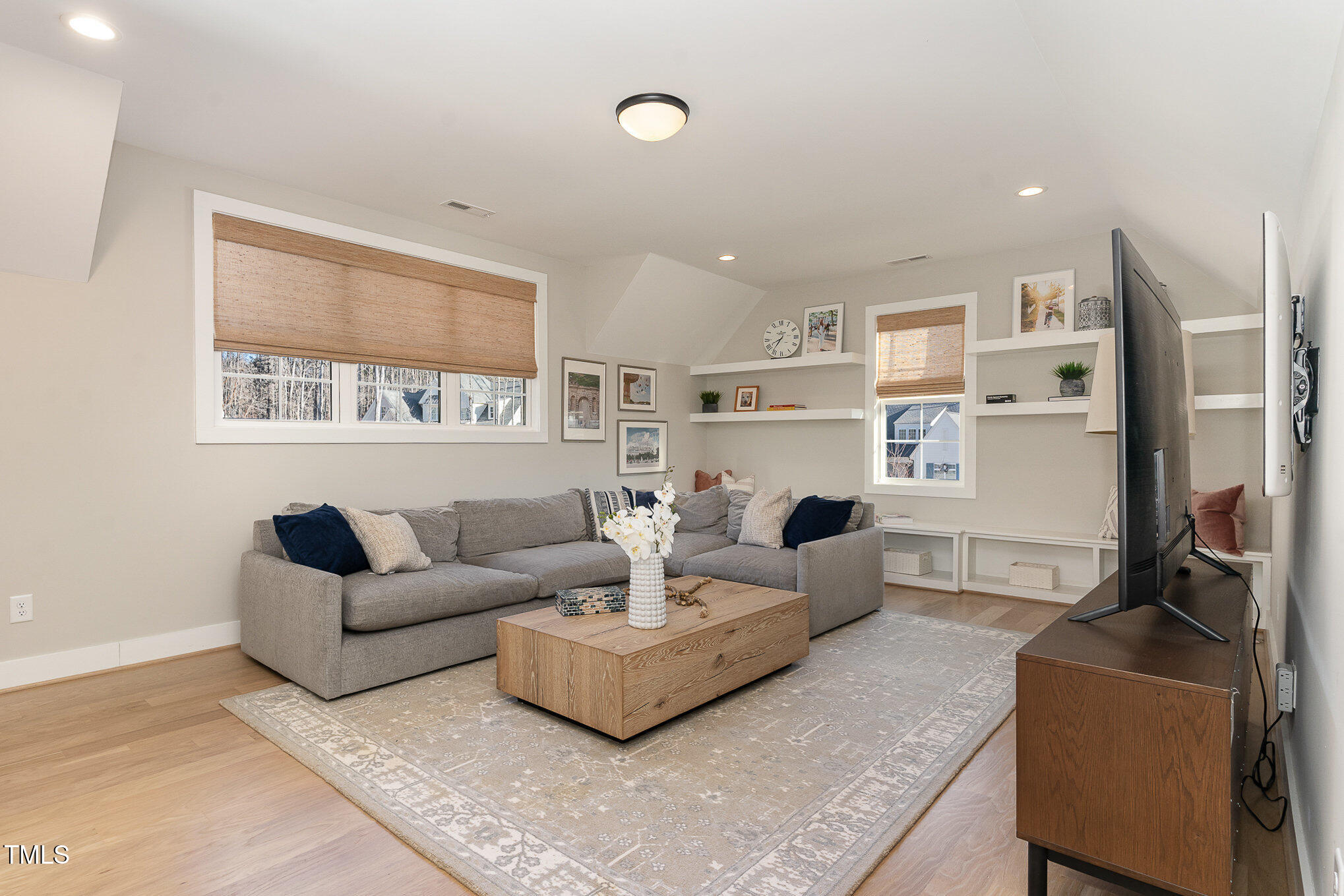 403 Stonecrest Way Pittsboro, NC 27312 - Photo 35 of 65 a living room with furniture and a flat screen tv