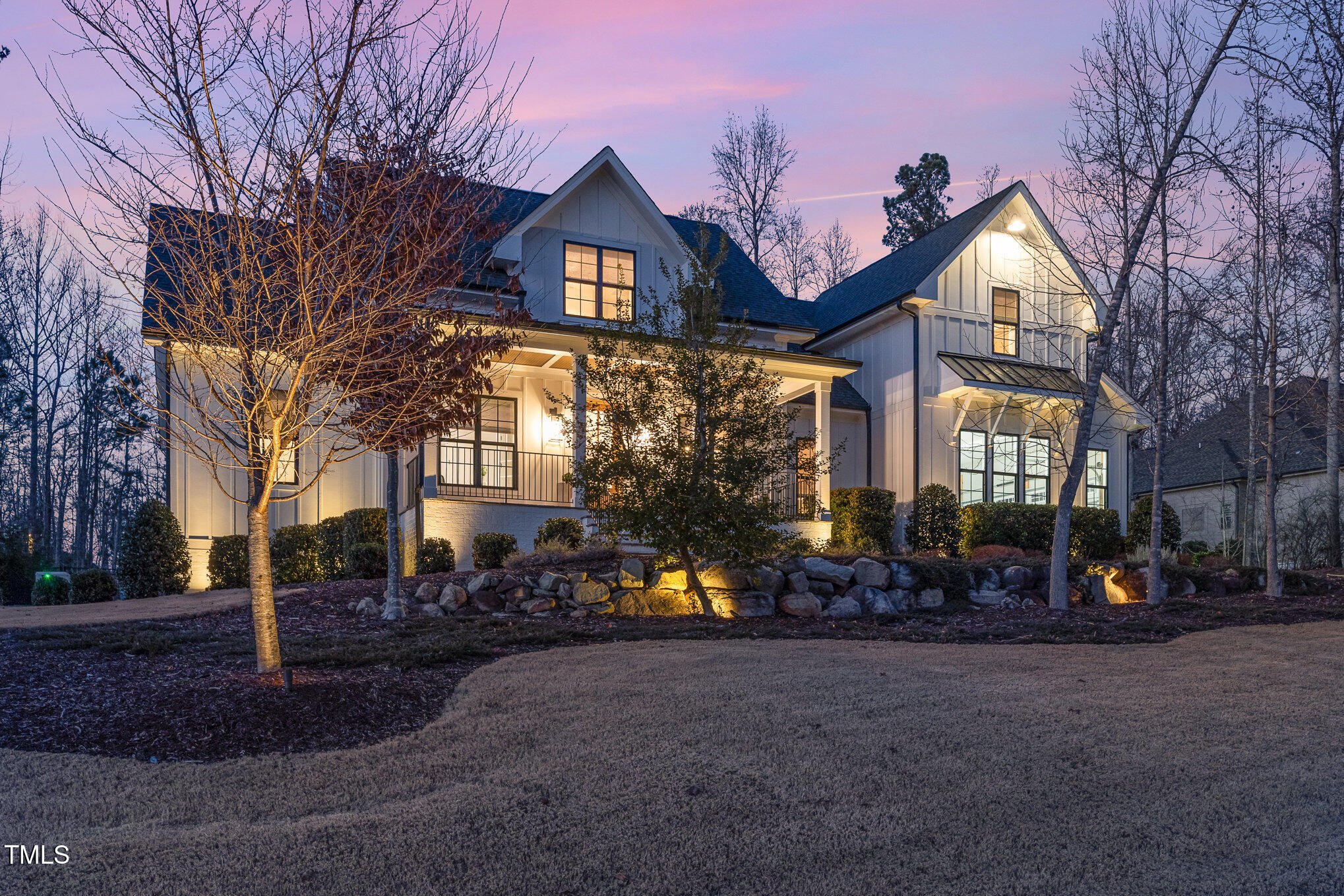 403 Stonecrest Way Pittsboro, NC 27312 - Photo 50 of 65 a front view of a house with garden