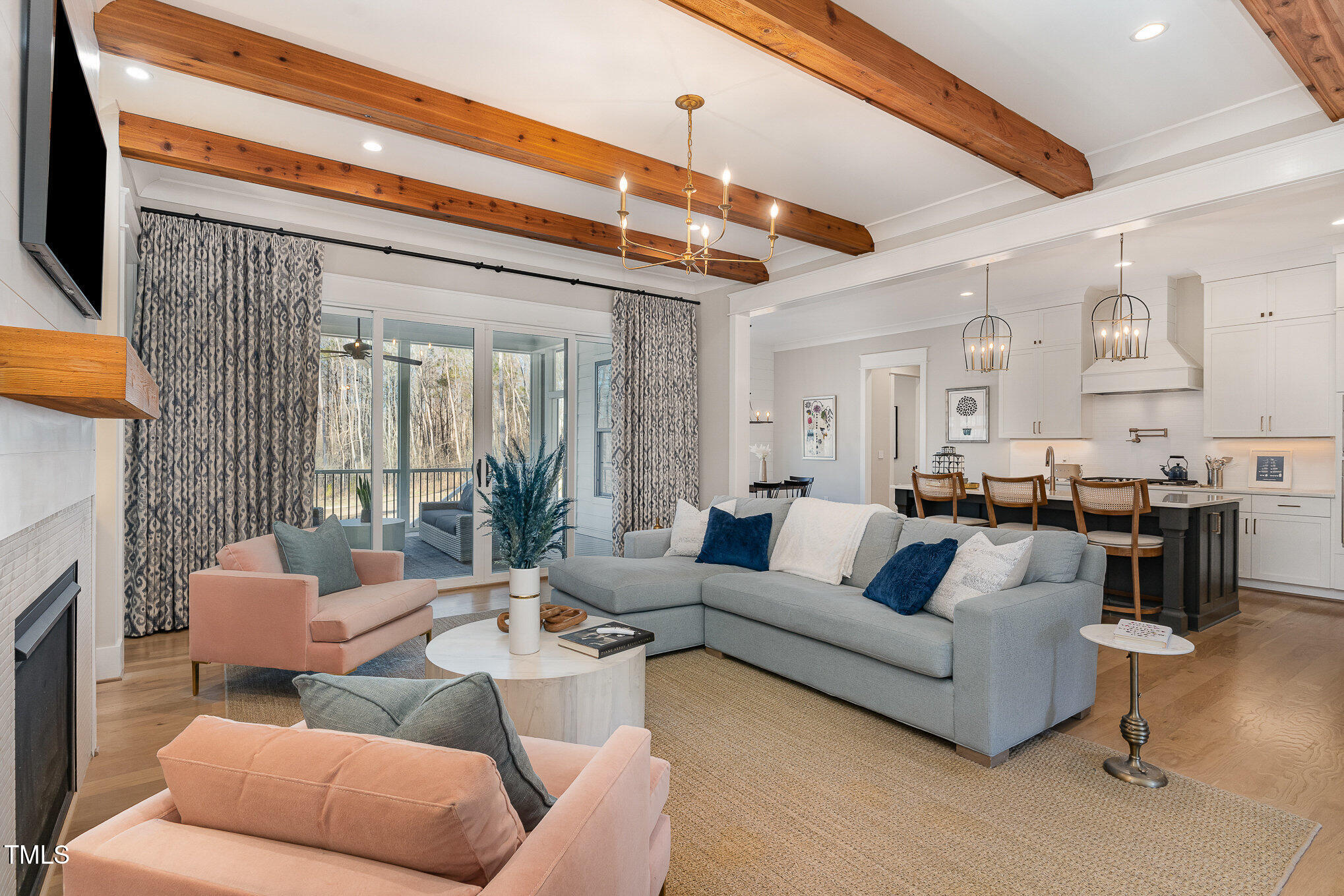 403 Stonecrest Way Pittsboro, NC 27312 - Photo 6 of 65 a living room with furniture and a fireplace