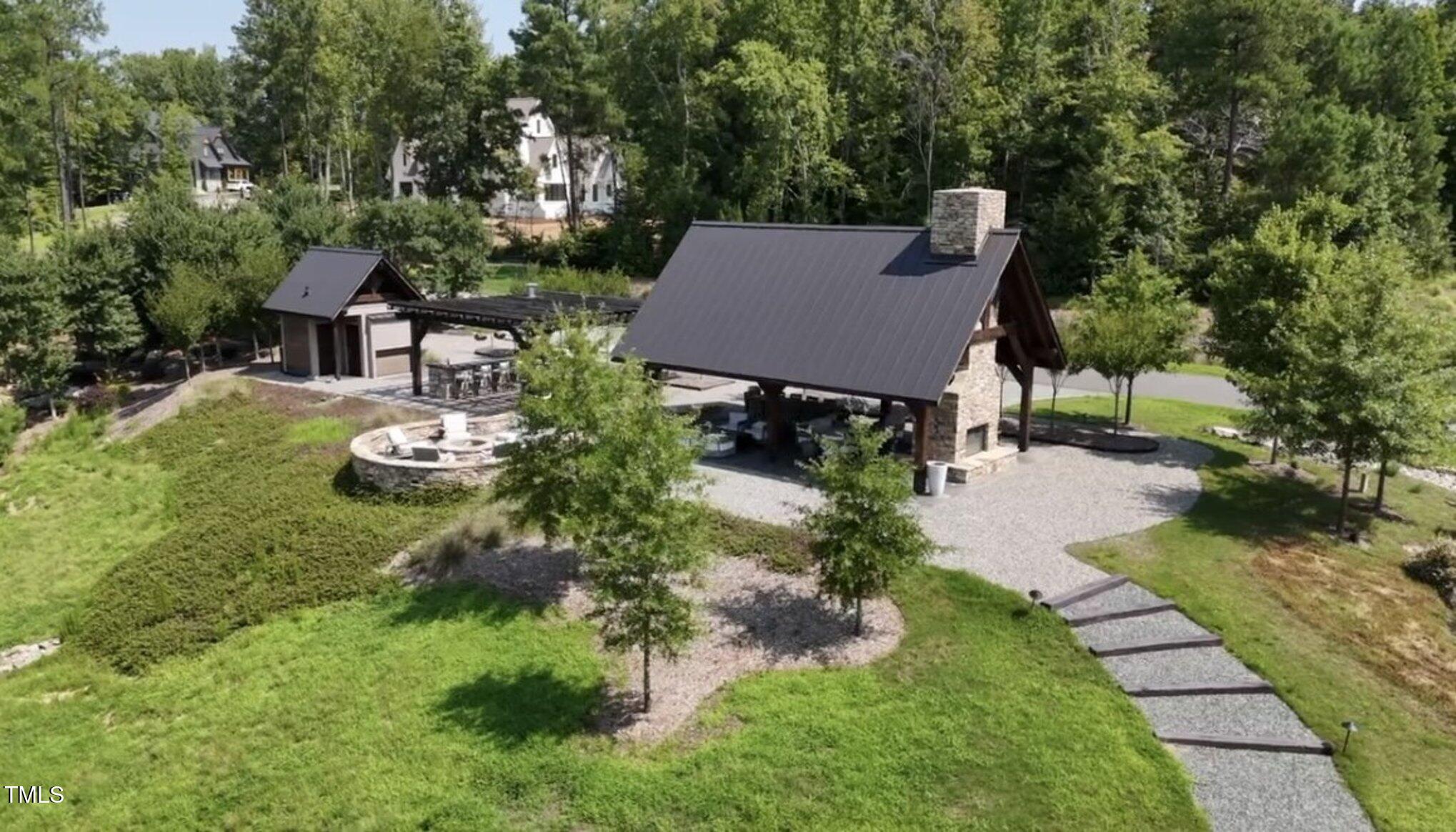 403 Stonecrest Way Pittsboro, NC 27312 - Photo 62 of 65 a view of house with backyard and outdoor seating