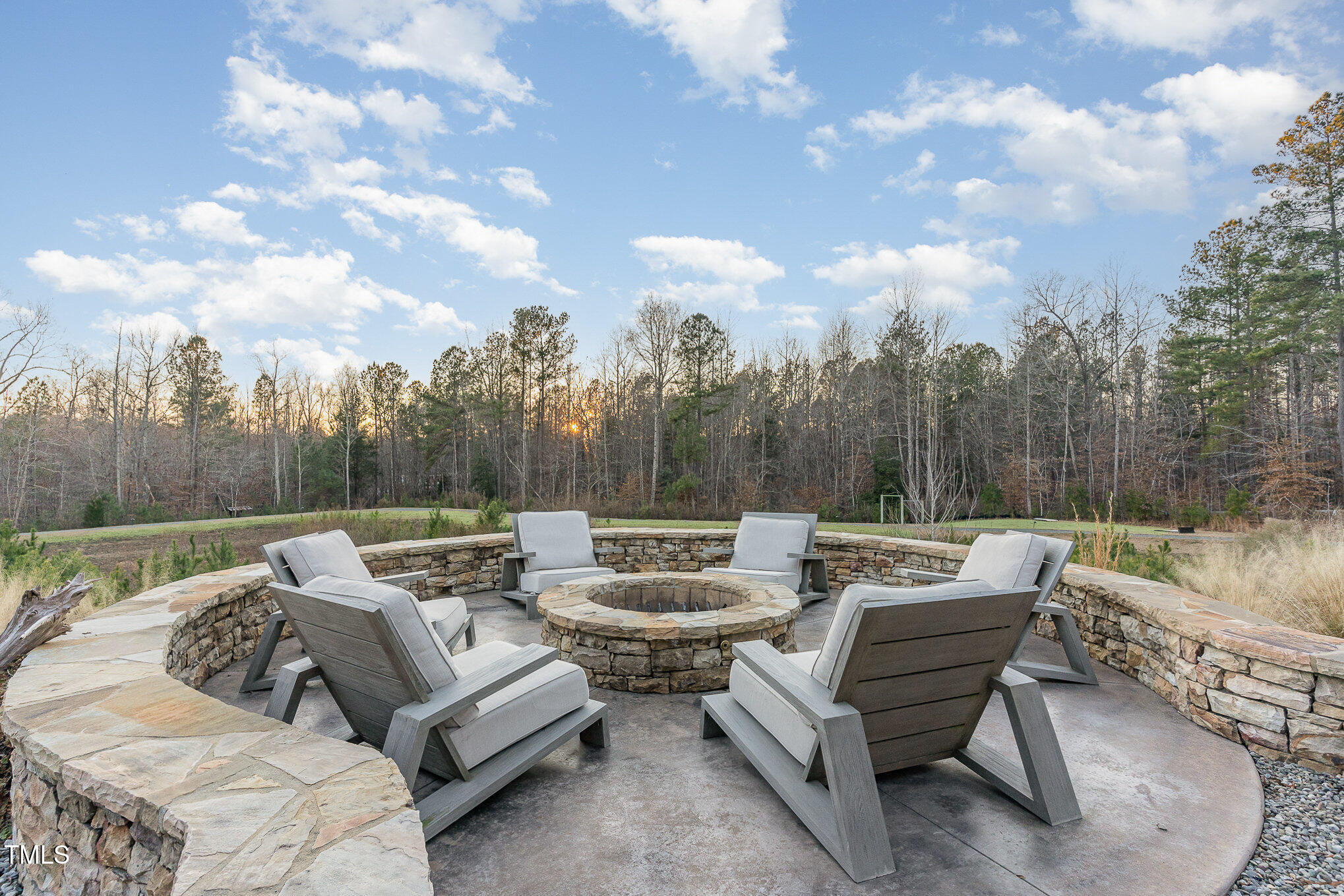 403 Stonecrest Way Pittsboro, NC 27312 - Photo 65 of 65 a patio with couch and a fire pit