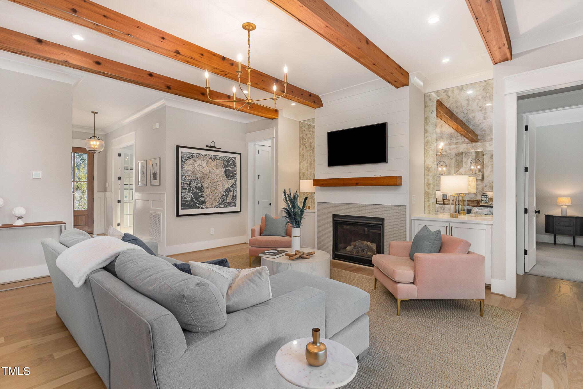 403 Stonecrest Way Pittsboro, NC 27312 - Photo 7 of 65 a living room with furniture and a fireplace