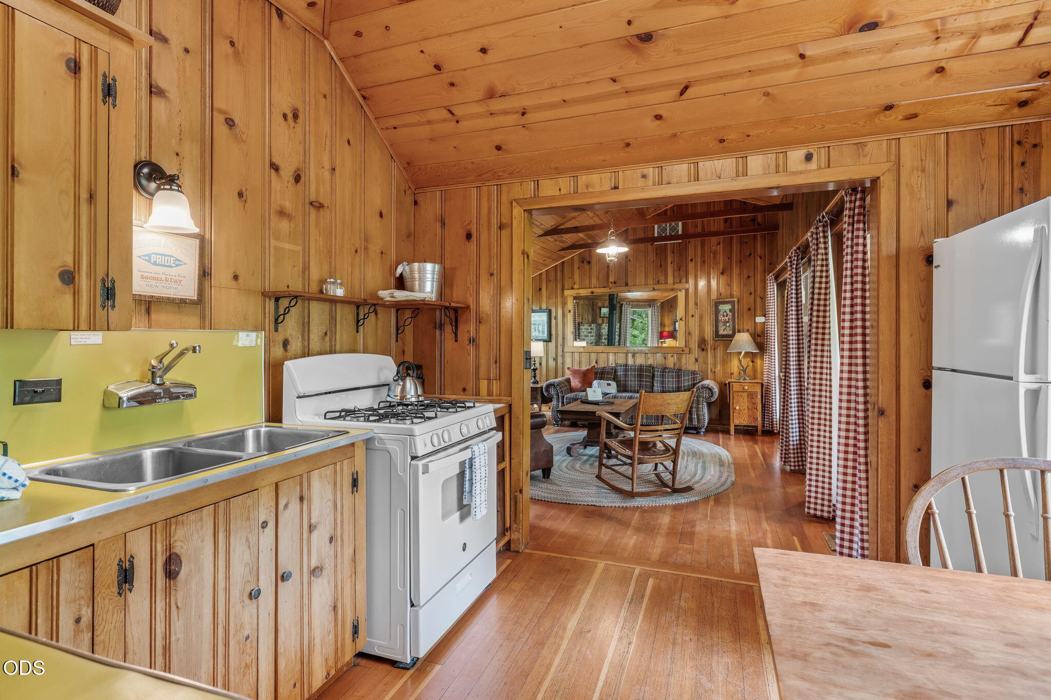13375 Southwest Forest Service Road, Unit 3 U1 Camp Sherman, OR 97730 - Photo 12 of 29 a kitchen with a sink and wooden cabinets