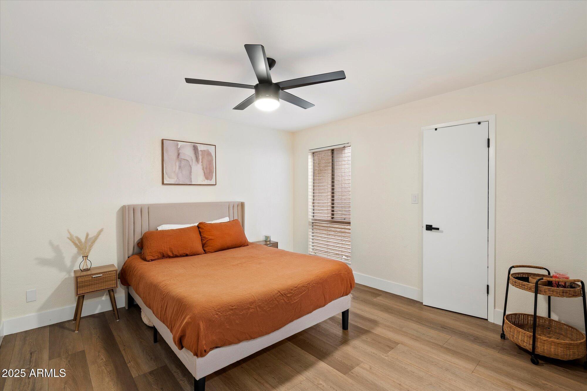 3415 North 36th Street, Unit 4 Phoenix, AZ 85018 - Photo 12 of 15 a bedroom with a bed and a table