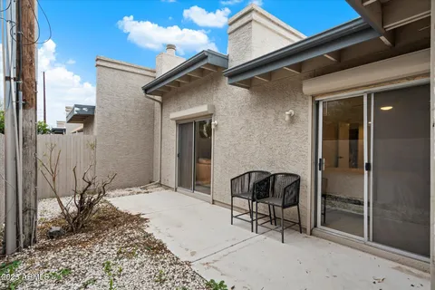 a view of backyard with wheel chair and potted plants
