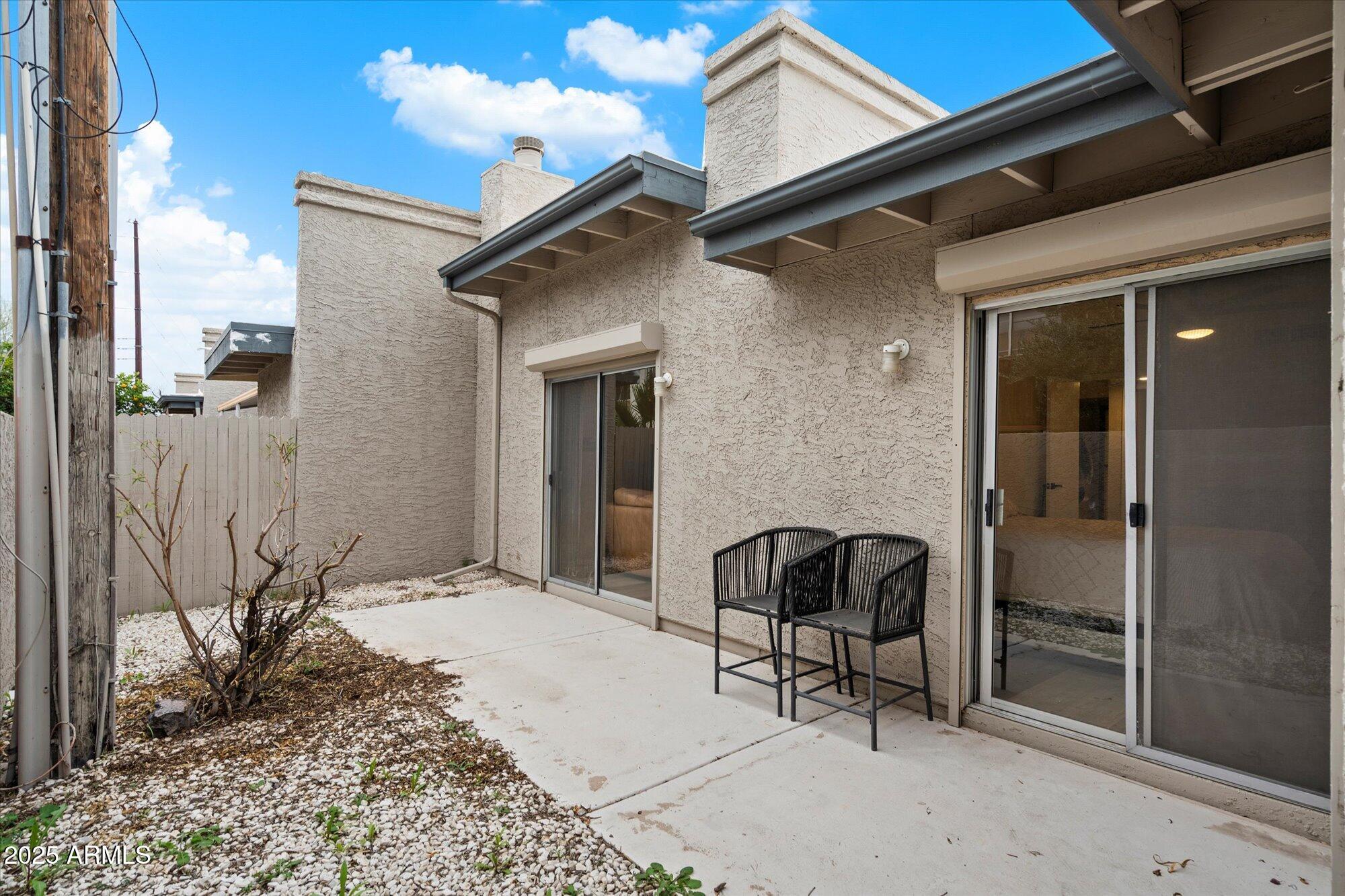 3415 North 36th Street, Unit 4 Phoenix, AZ 85018 - Photo 14 of 15 a view of backyard with wheel chair and potted plants