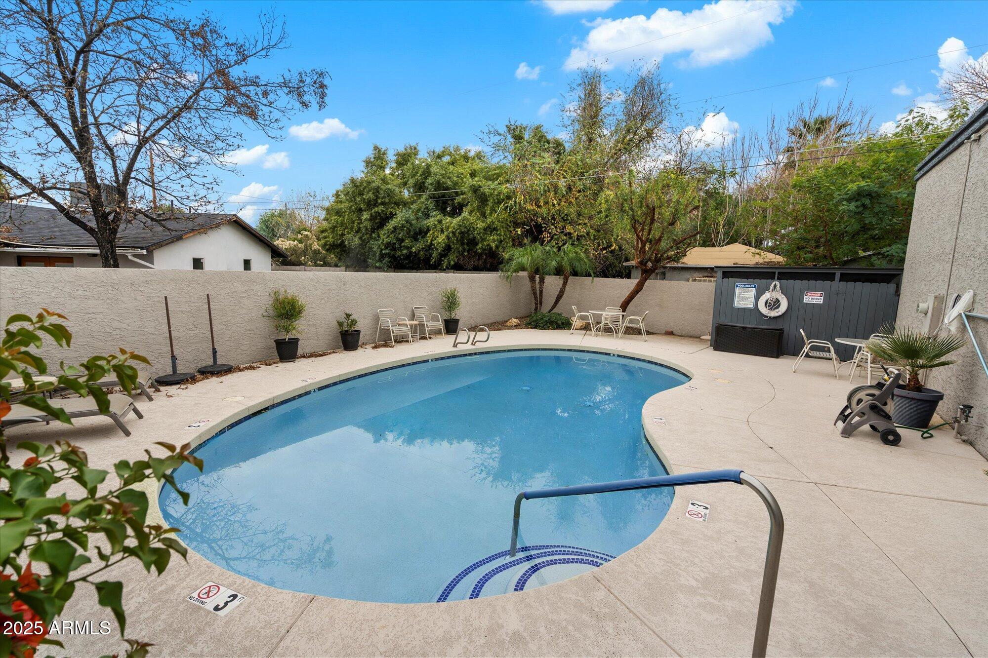 3415 North 36th Street, Unit 4 Phoenix, AZ 85018 - Photo 15 of 15 a view of outdoor space and swimming pool