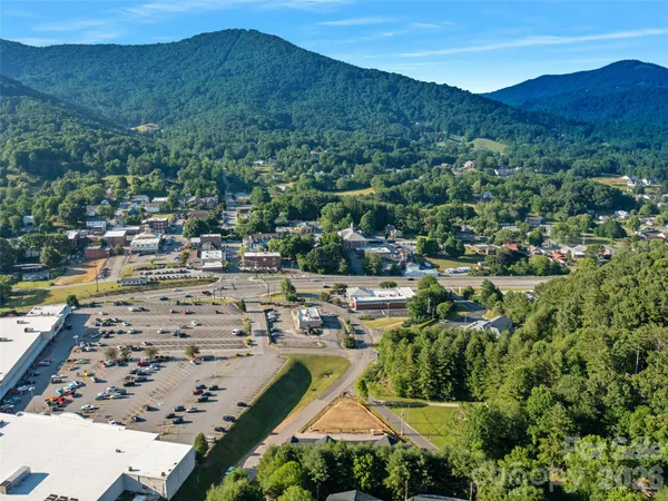 an aerial view of residential houses and outdoor space