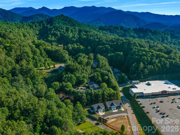 an aerial view of a house with mountain view