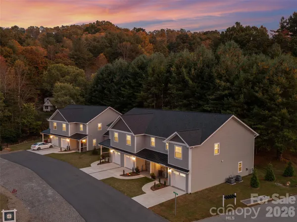 an aerial view of a house with a big yard
