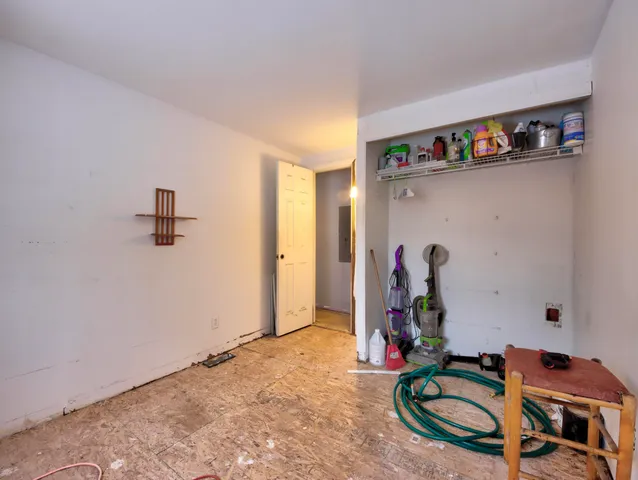 a view of a big room with a rug