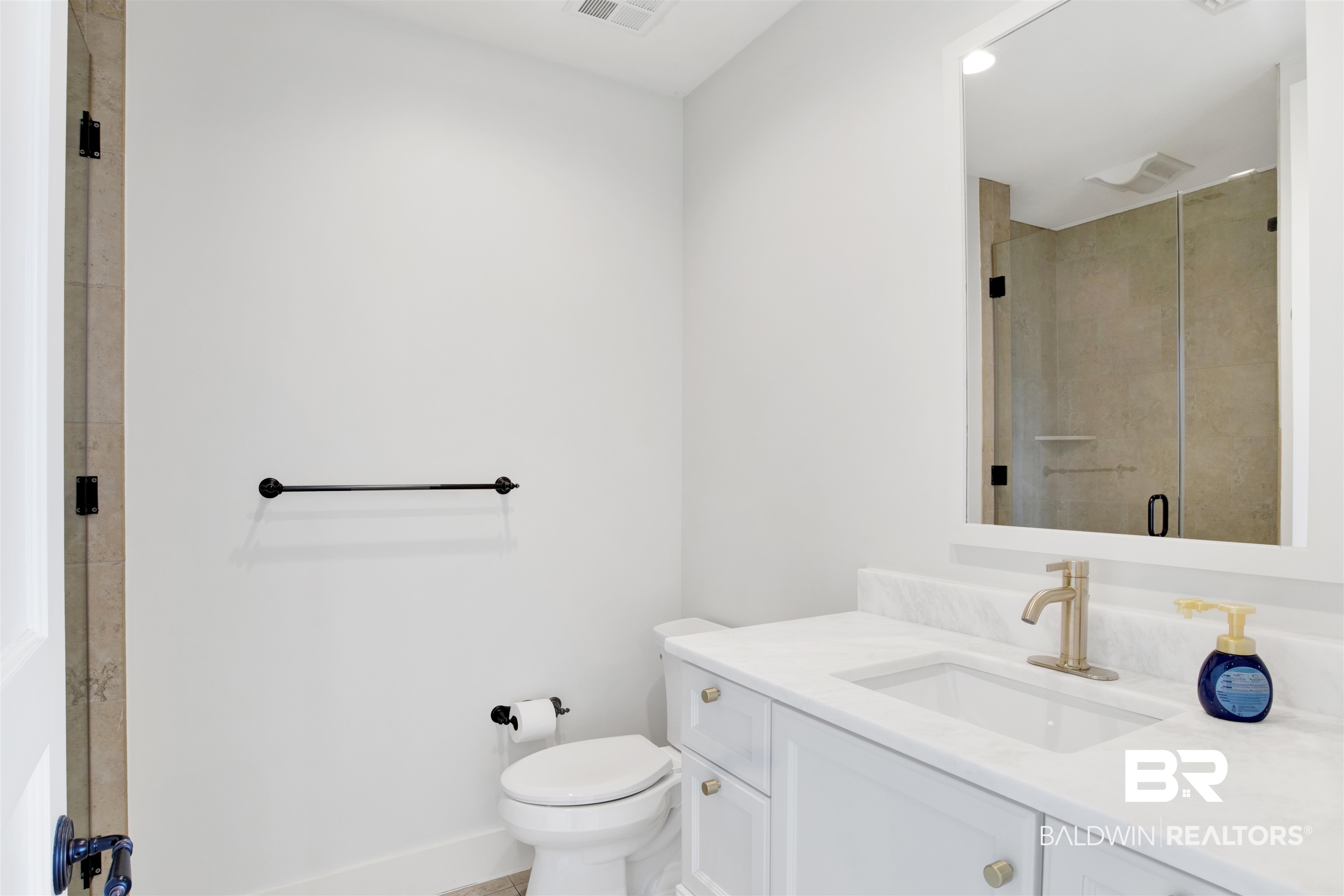 18269 Colony Drive, Unit 601 Fairhope, AL 36532 - Photo 12 of 47 Bathroom featuring tiled shower, vanity, and toilet