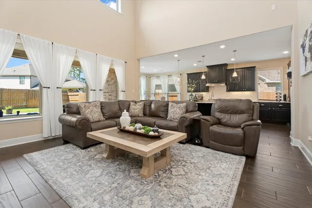 a living room with furniture and a table