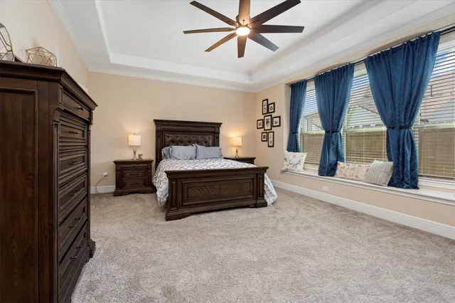 a bedroom with furniture and window