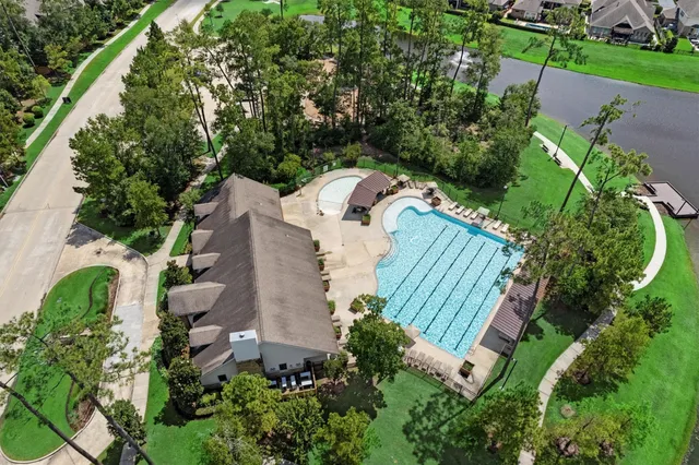 an aerial view of a house with outdoor space and street view
