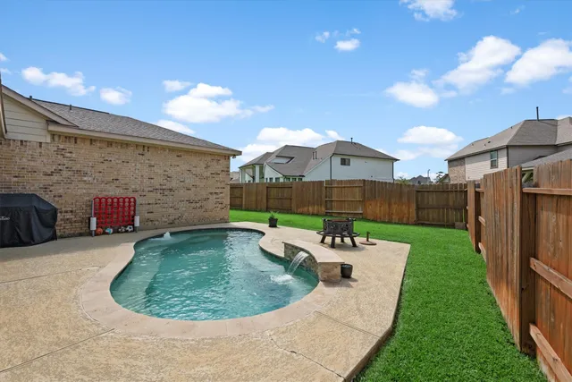 a view of a backyard with sitting area