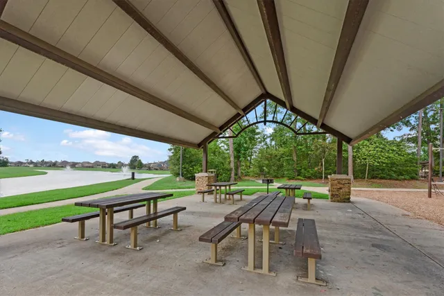 a view of chairs and table in patio with a yard