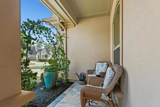 a with a potted plant sitting in front of a door