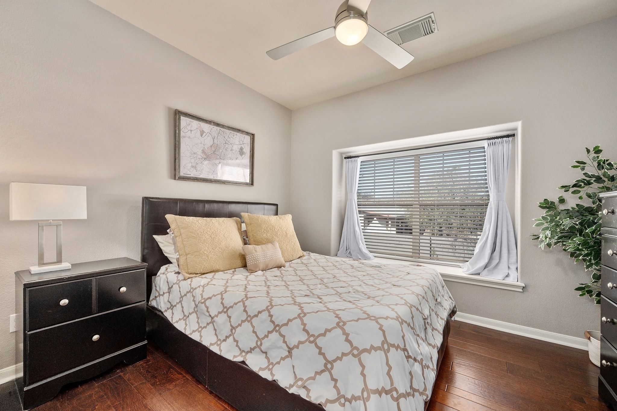 2905 Saville Loop Austin, TX 78741 - Photo 17 of 30 a bedroom with a bed and a window