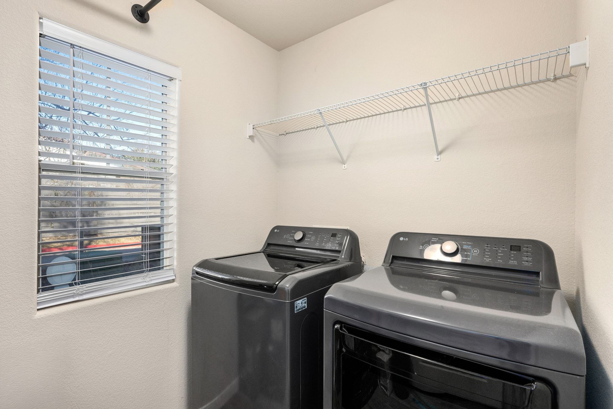 2905 Saville Loop Austin, TX 78741 - Photo 20 of 30 a utility room with dryer and washer