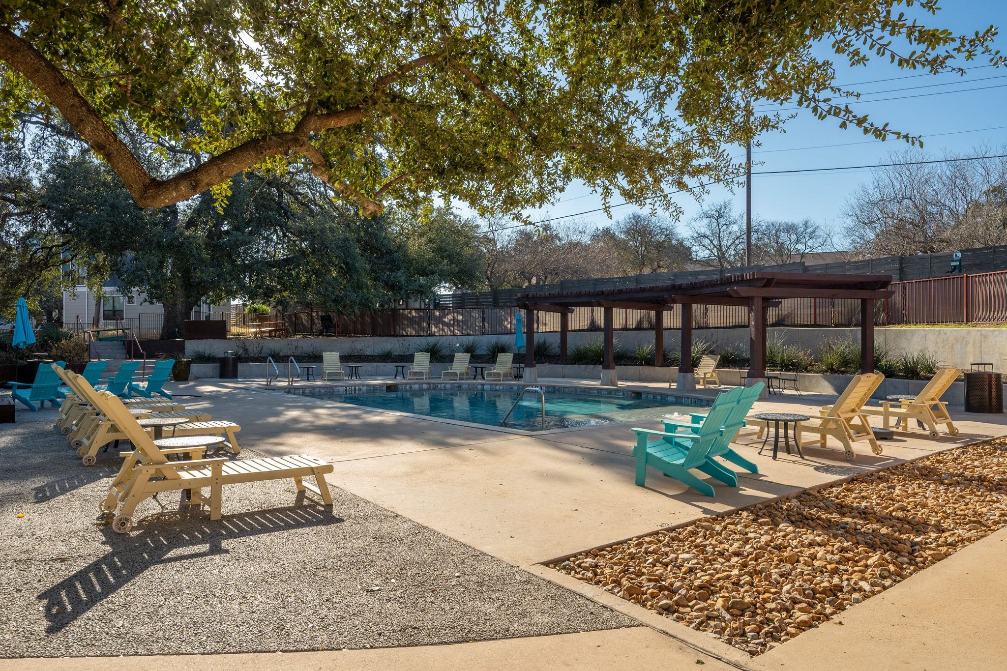 2905 Saville Loop Austin, TX 78741 - Photo 23 of 30 a view of a swimming pool with lounge chairs in patio