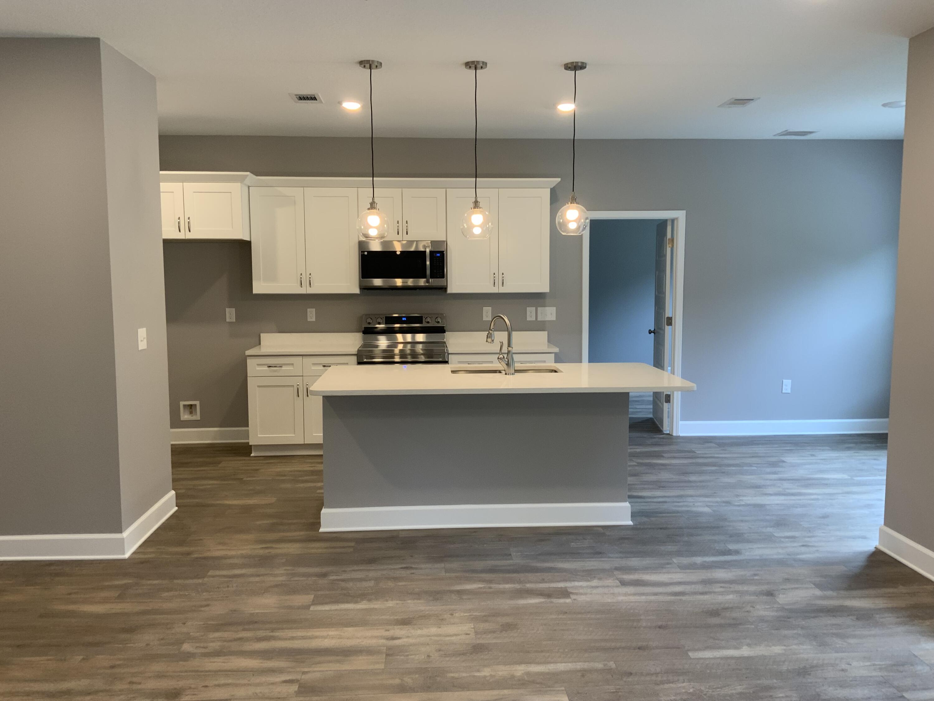 5188 Rabbit Run Crestview, FL 32539 - Photo 6 of 13 a view of kitchen with kitchen island stainless steel appliances a sink and cabinets