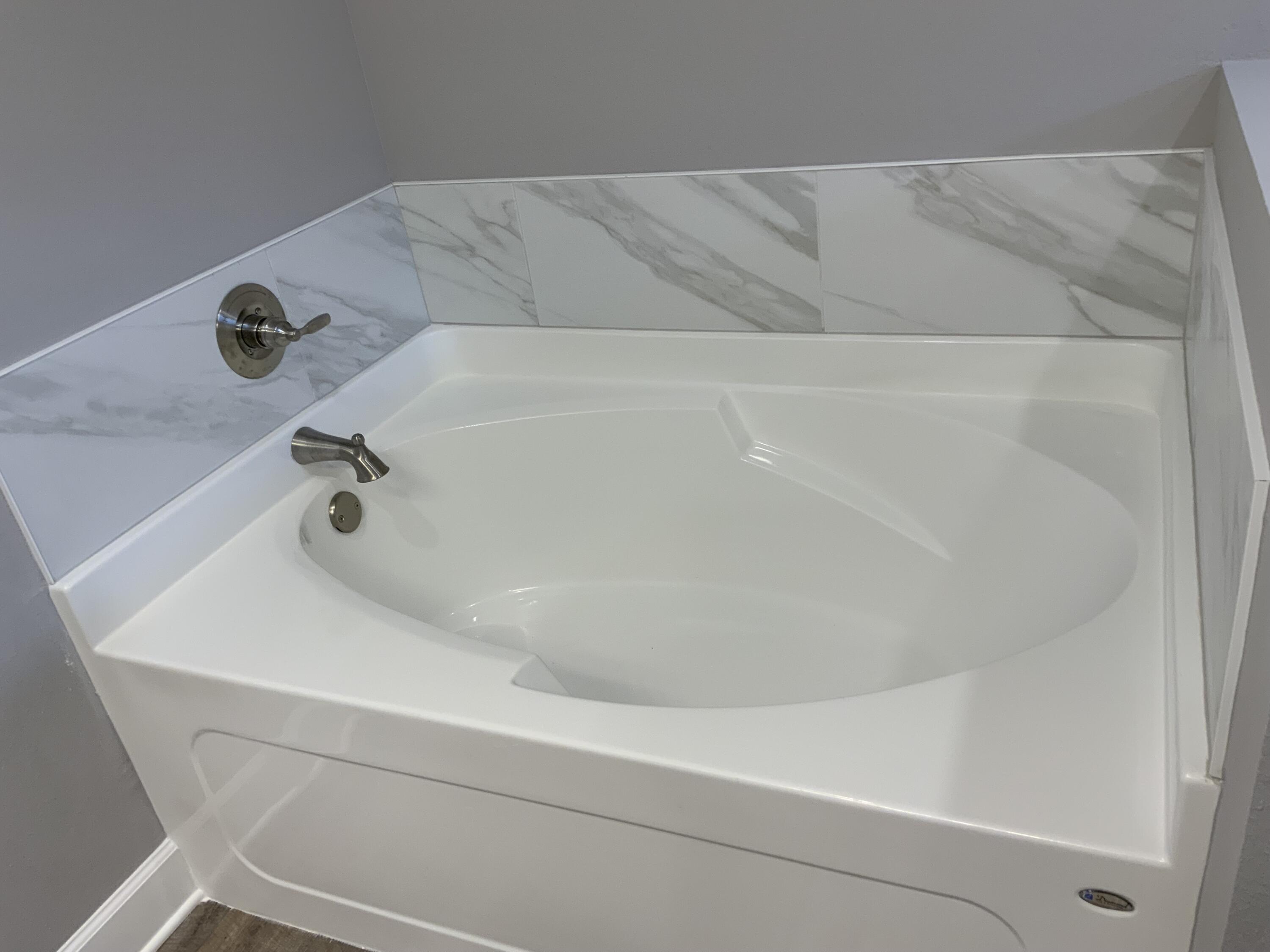 5188 Rabbit Run Crestview, FL 32539 - Photo 8 of 13 a close view of a bathtub in a bathroom
