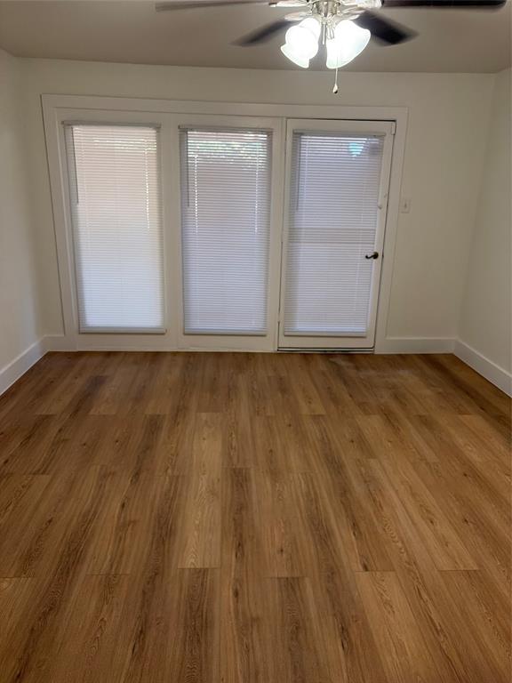 5550 Spring Valley Road, Unit E23 Dallas, TX 75254 - Photo 6 of 19 Large primary suite with private balcony overlooking the pool and a super large storage or workroom area.