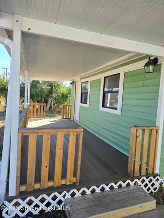 a view of a porch with furniture