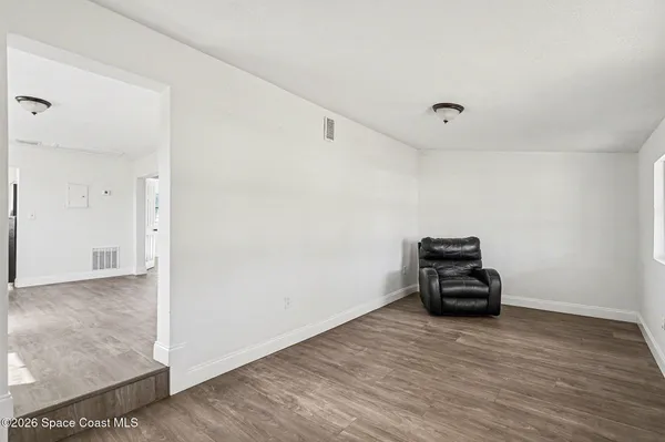 a view of a livingroom with wooden floor