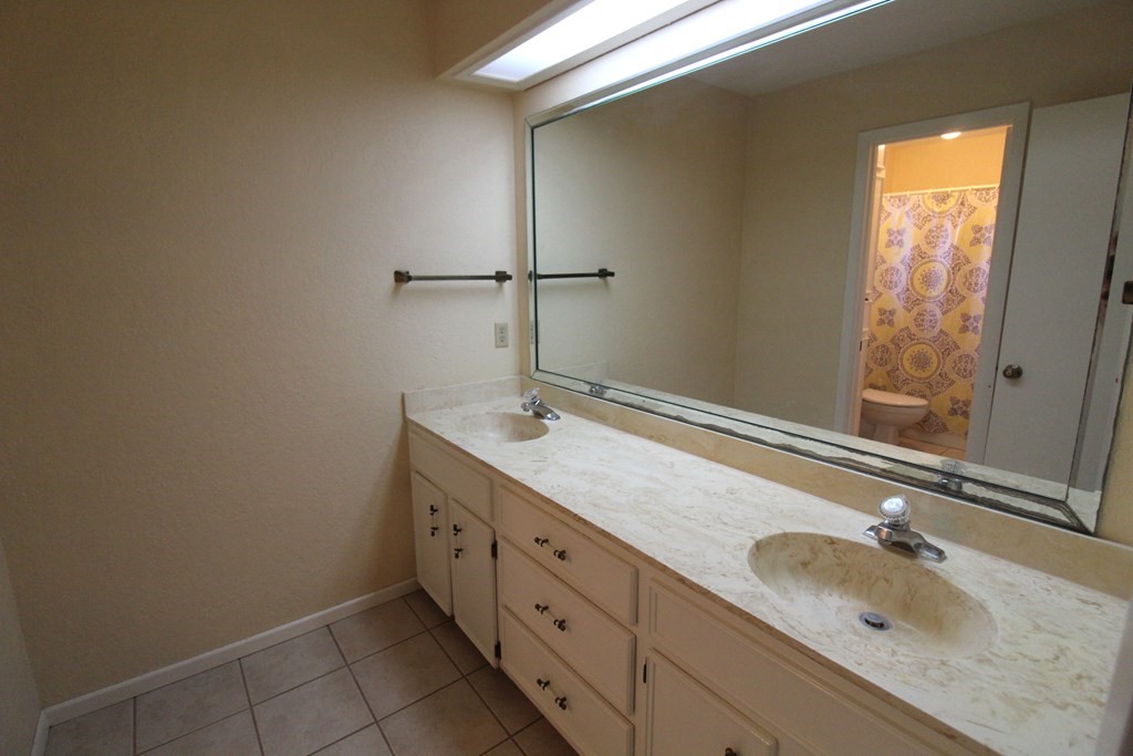 1910 Oak Ridge Drive Portland, TX 78374 - Photo 26 of 40 a bathroom with a granite countertop sink and a mirror