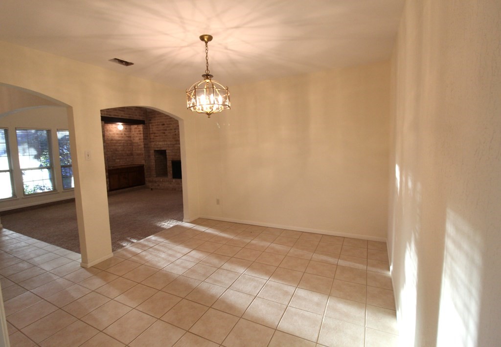 1910 Oak Ridge Drive Portland, TX 78374 - Photo 30 of 40 a view of a hallway with wooden floor and chandelier