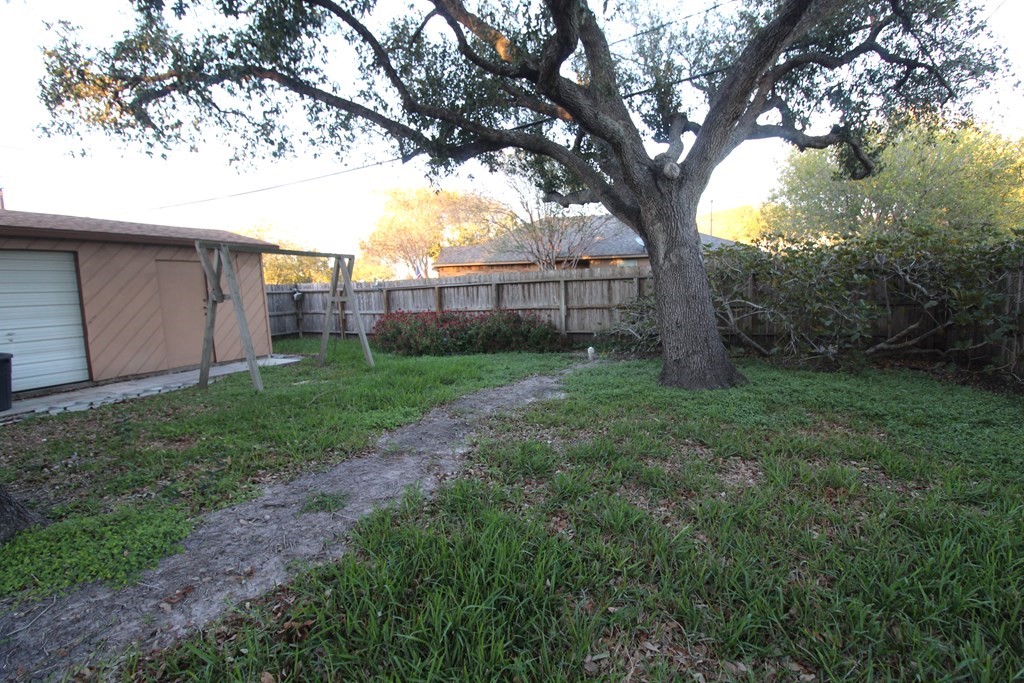1910 Oak Ridge Drive Portland, TX 78374 - Photo 33 of 40 a view of a yard with a large tree
